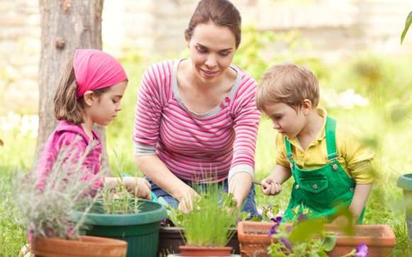 family-planting-containers-in-the-garden